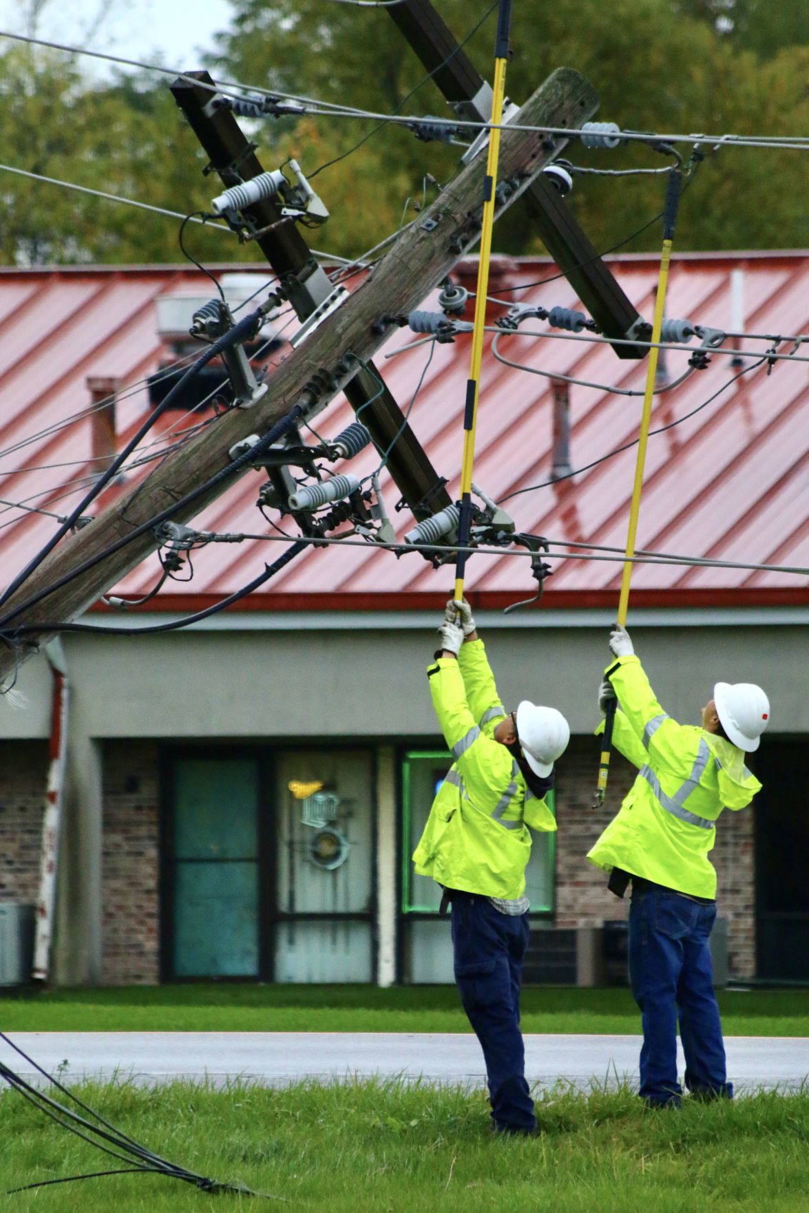 Power poles shear off in chain, knocking out power in Winfield